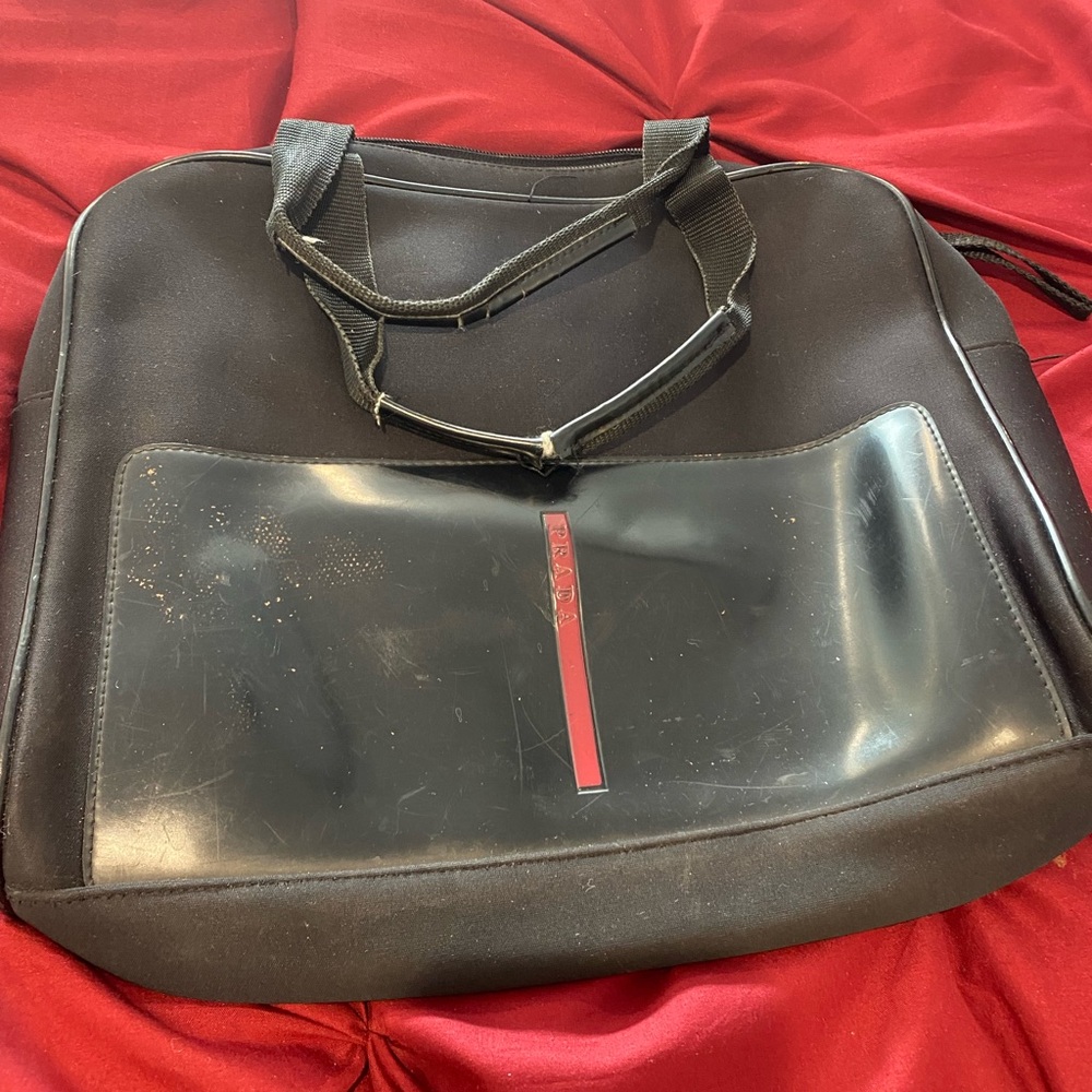 Damaged Prada carry case bag